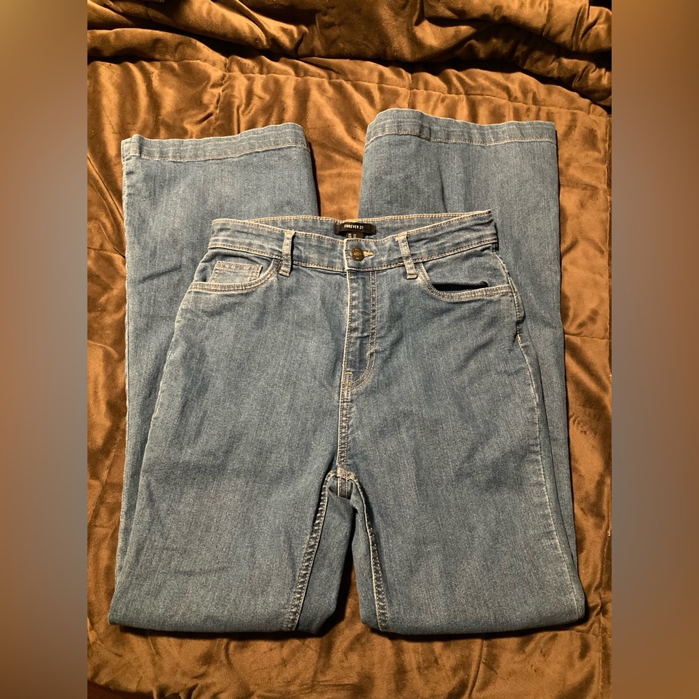 Forever 21 brand,size 27, blue denim flare leg,rainbow stitching on back pockets
